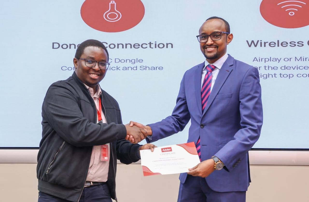 CEO Abdiwahab Haji receiving award certificate at Jubilee Insurance HQ